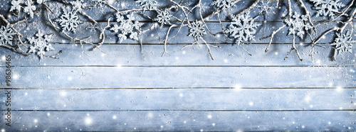 Winter Branches On Wooden Plank With Snowflakes