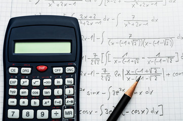 Wall Mural - Maths concept - handheld calculator and pencil over a sheet of paper with maths-formulas
