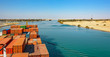Industrial container ship passing through Suez Canal with ship's