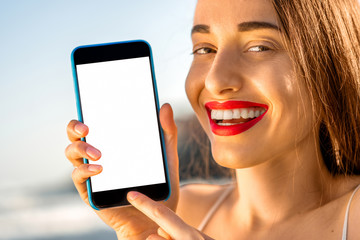 Woman showing phone with white screen