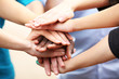 © Africa Studio - White caucasian and black afro american hands holding together, friendship concept