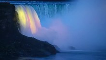 Niagara Falls - Birds Fly In Front Of Illuminated Horseshoe Falls A.k.a. Canadian Falls As Seen From The Canadian Side In The Evening