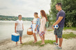 © bokan - Group of young friends ready for picnic at the beach
