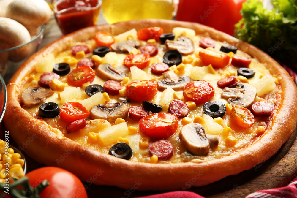 Delicious pizza with vegetables and meat, close-up