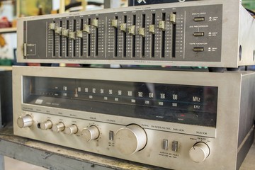 Retro electric amplifier close-up with knobs - music amplifier
