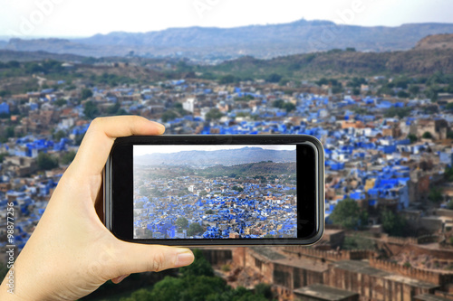 blue city JODHPUR, India. Taking photo on smart phone concept. Poster