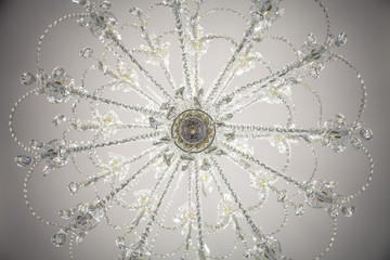 Looking up at a chandelier from below