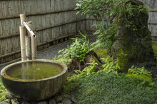 Shishi Odoshi,Japanese Zen Garden In Shirakawago (or Shirakawa-go), A Traditional Village In Gifu Prefecture, Japan. It Is A UNESCO World Heritage Site.