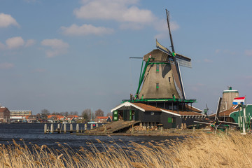 Traditional Dutch old wooden windmill in Zaanse Schans