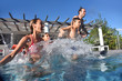 Family jumping into pool swimming-pool