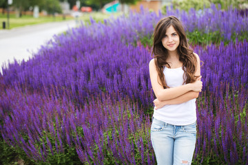 Wall Mural - portrait of a beautiful young modern woman outdoors. student in the park.