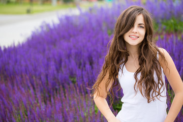 Wall Mural - Cute smiling woman in park.