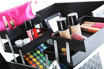 make up case with cosmetics on a white background