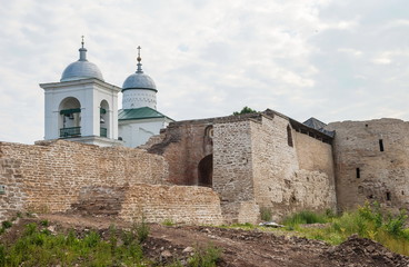  Church and walls of ancient fortress Izborsk in Russian