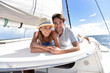 © goodluz - Couple laying on a sailboat deck during cruise