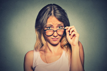 confused skeptical woman thinking looking at you with disapproval