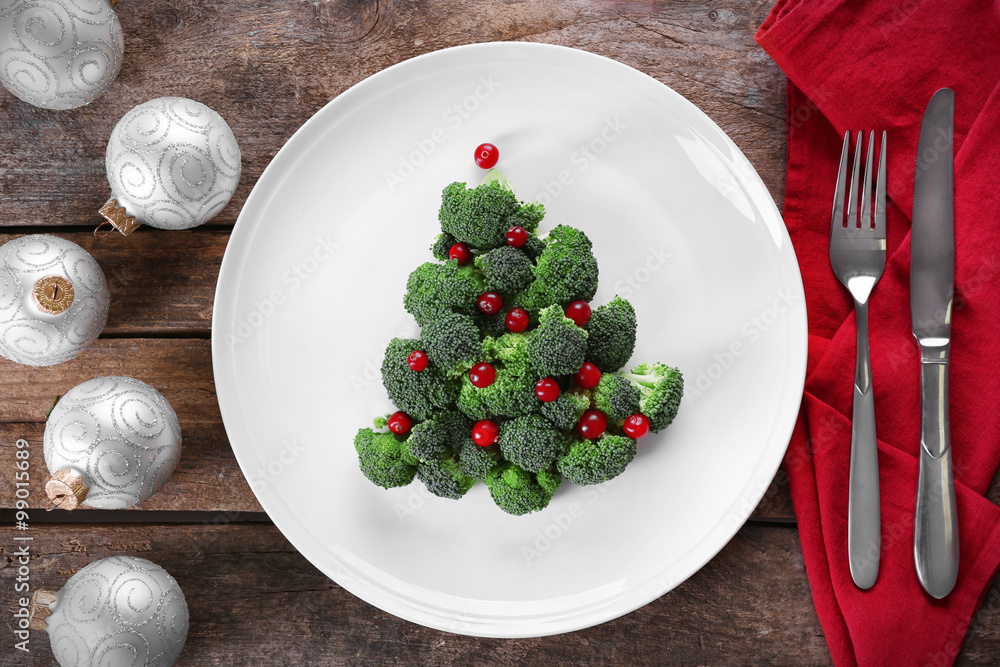 Christmas fir tree made from broccoli, on plate, close up