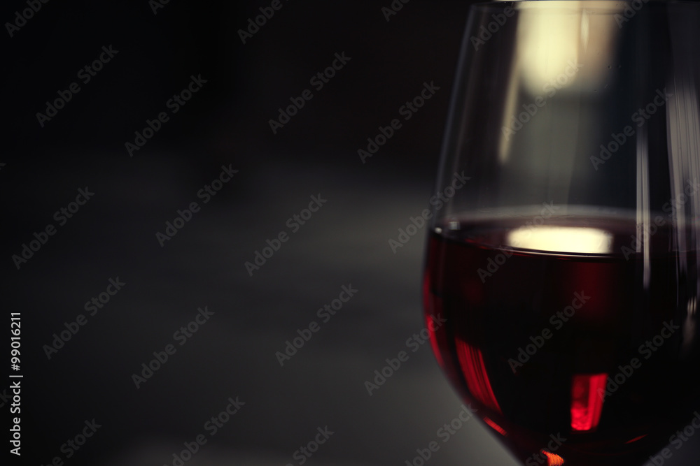 Glass of red wine on blurred background