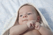 © WH_Pics - Cute baby boy wrapped bath towel after bath in bed at home