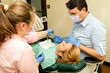 © diyanadimitrova - Dentist doing a dental treatment on a patient