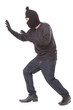 © japhoto - Burglar wearing mask on over white background