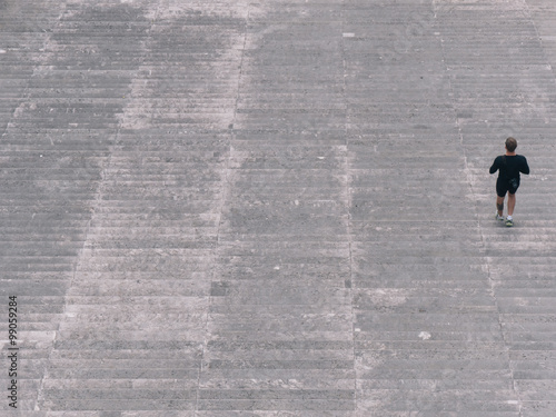 Photo  runner on stairs running up and down working for achievements and career success