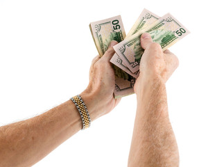 Caucasian ethnicity hands offering cash in US fifty dollar bills