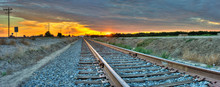 Panoramic View Of Railroad Tracks Crossing The Frame From Right To Left. 