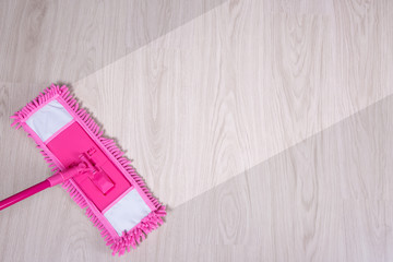 Wall Mural - cleaning concept -pink wet mop cleaning wooden floor