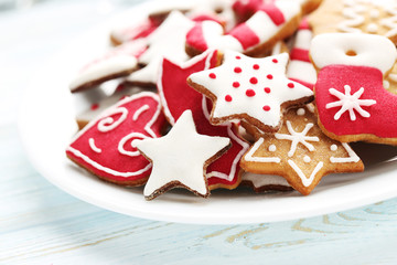 Wall Mural - Christmas cookies in plate on a blue wooden table