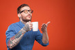 © Yakobchuk Olena - Cute bearded man is smelling hot drink