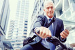 © Sergey Nivens - Successful businessman on bicycle with mobile phone