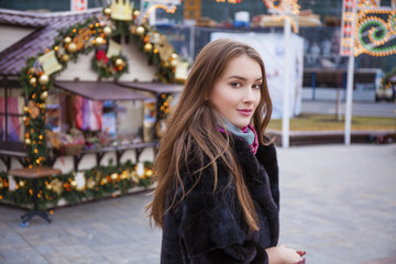 Wall Mural - Young beautiful woman in stylish mink coat