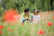 © javiindy - Mother with her little daughter in poppy field