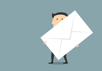 Businessman with big paper postal envelope