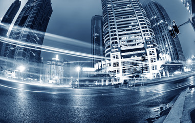 Wall Mural - the light trails on the modern building background in shanghai china