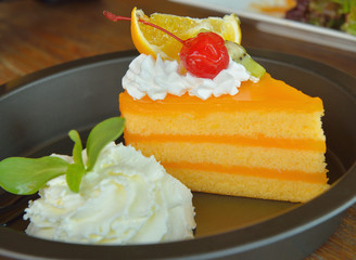 Poster - Orange cake  on wooden background