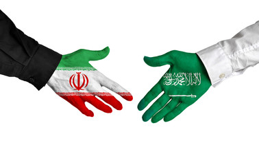 Iran and Saudi Arabia leaders shaking hands on a deal agreement