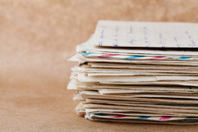Stack Of Old Envelopes And Letters On Kraft Paper