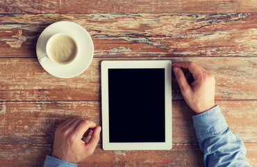 Poster - close up of male hands with tablet pc and coffee