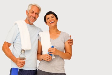 Wall Mural - Composite image of portrait of a happy fit couple