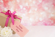 Valentine's gift and roses with a bright glittering background