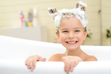 cute little girl washing her hair