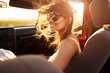 Woman Passenger On Road Trip In Convertible Car