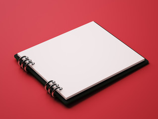 Wall Mural - Blank White Paper Notepad isolated on red background