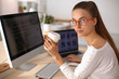 © shefkate - Young woman working in office, sitting at desk