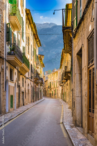 Fototapeta na wymiar View of an picturesque old town buildings street and mountains