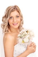 Wall Mural - Young bride holding a wedding flower