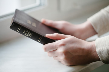 Wall Mural - woman hands over the bible