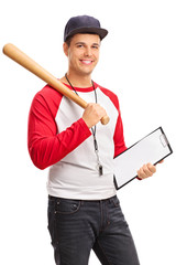 Wall Mural - Young male baseball coach holding a clipboard